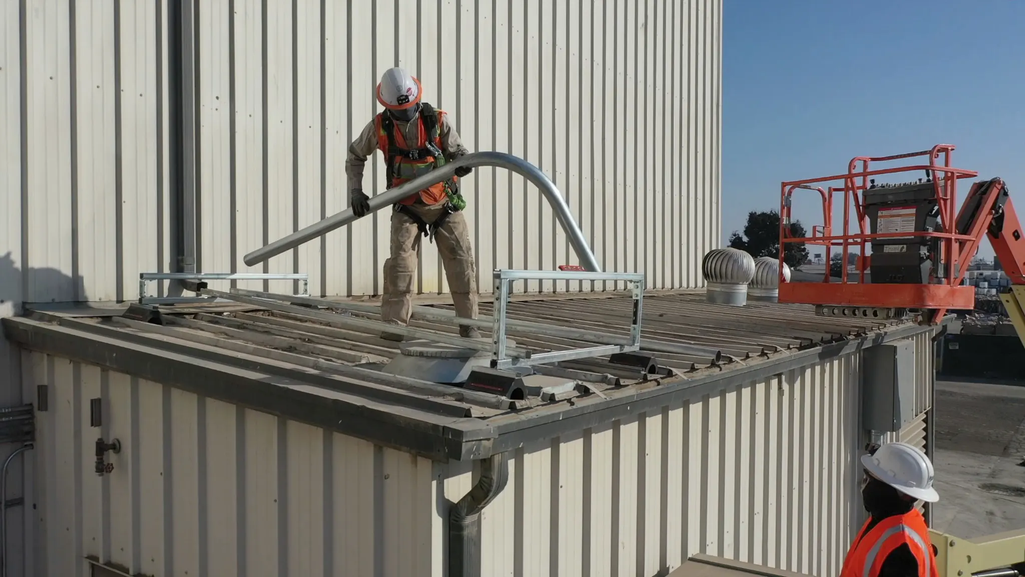 Electrician installing large conduit.