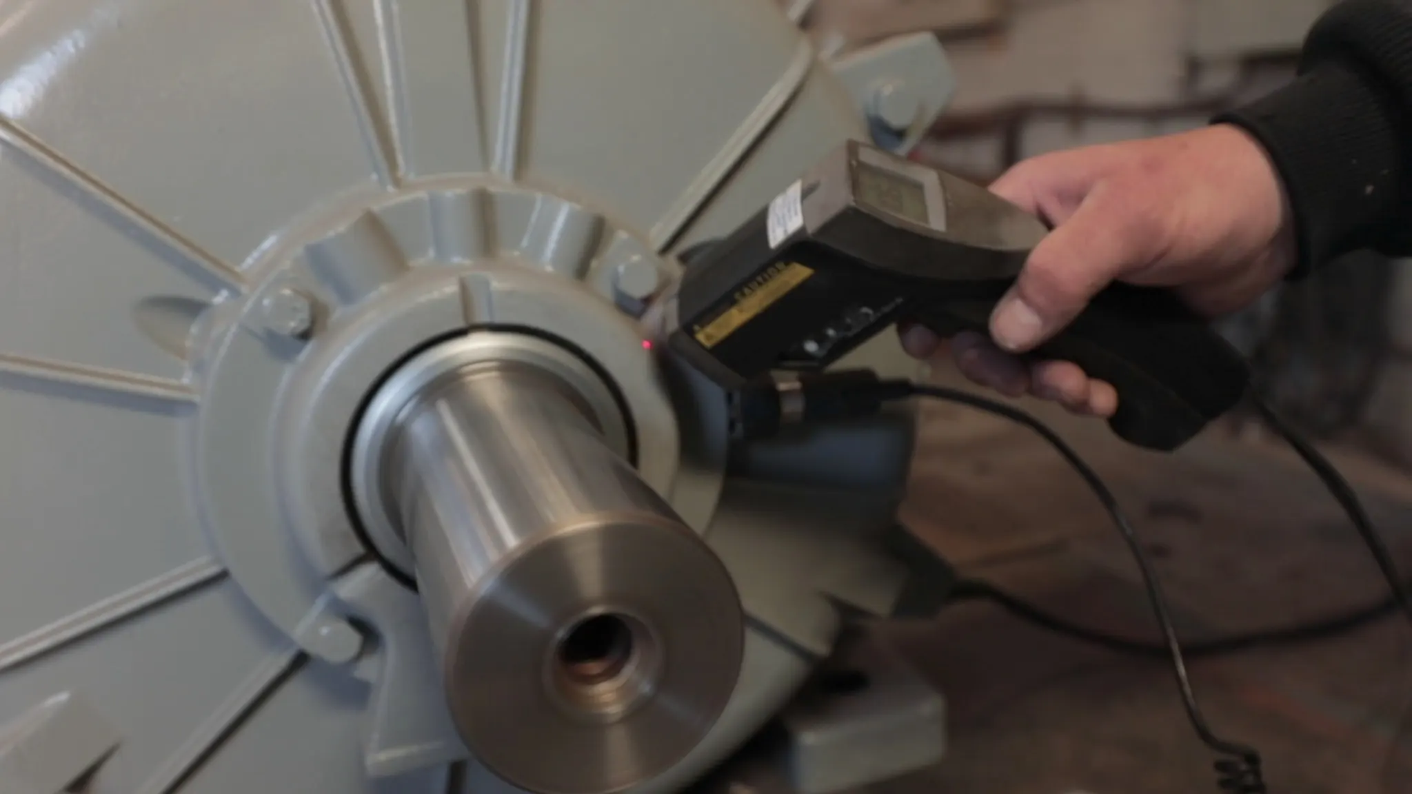 Laser alignment being performed on electric motor