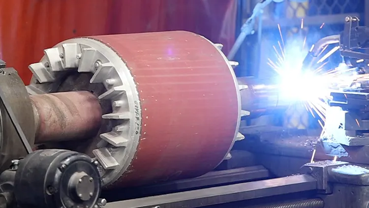 Electric motor shaft being repaired.
