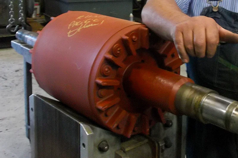 Rotor staged for testing at Electric Motor Shop to verify bar integrity and prepare for reassembly.